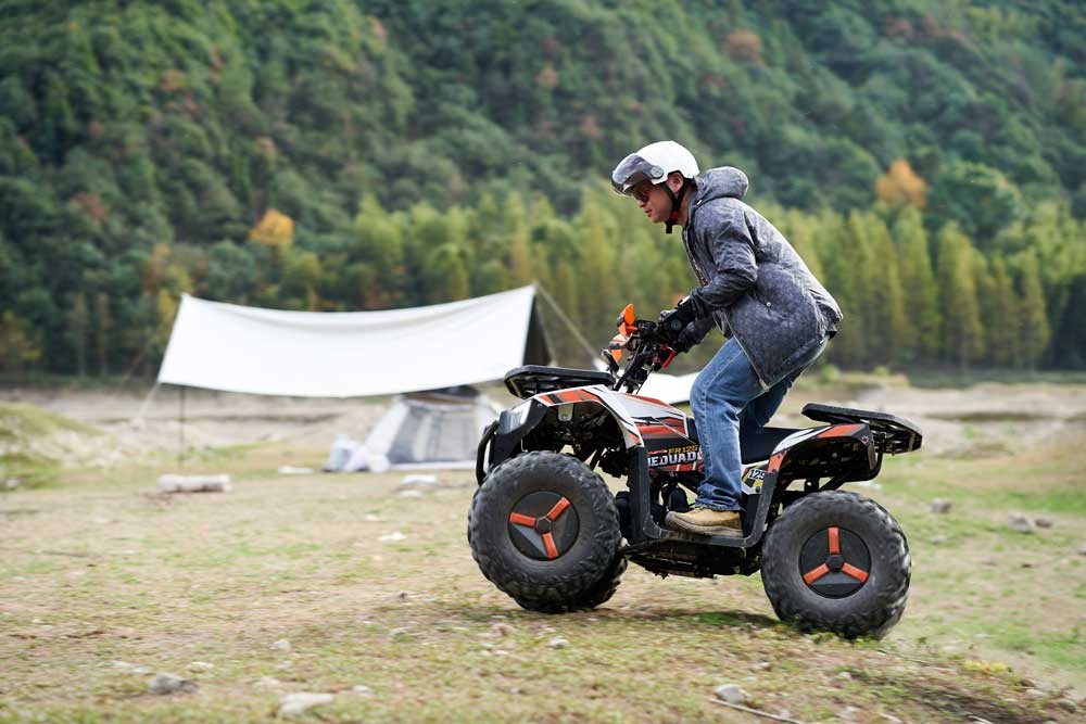 Gas powered ATV at a campsite for trail recreation, rental fleet and family use