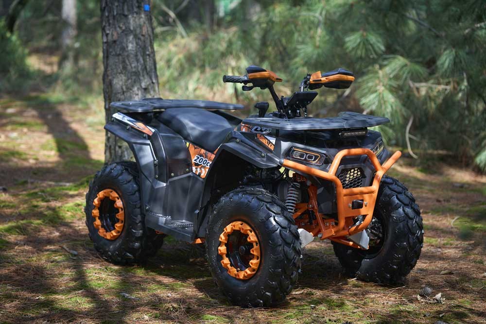 FR200ATV-UT gas powered ATV climbing rough unpaved terrain on farm ATV duty